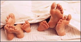  parents and baby feet